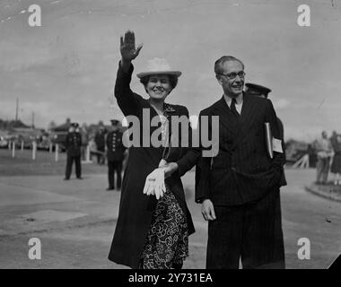 Mr Attlee leaves for Peace Conference. The Prime Minister, the Rt Hon C R Attlee, MP, left by air this afternoon (Sunday) for Paris, where he will deputise for the Foreign Secretary at the Peace Conference, which opens tomorrow at the Luxembourh Palace. He was accompanied by Mr Hector McNeil, Parliamentary Undersecretary of State for Foreign Affairs, and Mr Glenvil H Hall, Financial Secretary to the Treasury. The Rt Hon A V Alexander, First Lord of the Admiralty, left by air for Paris earlier today.  Photo shows, Mrs Attlee waves goodbye as her husband aircraft takes off from London Airport fr Stock Photo