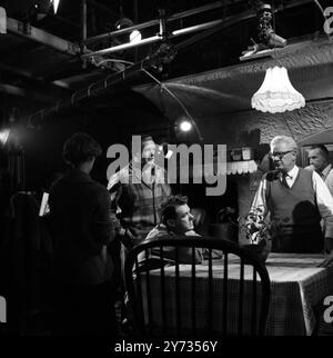 Ealing Studios. The filming of the British thriller, The Siege of Pinchgut at Ealing Studios.  Photo shows ; A break in filming  with US actor , Aldo Ray ( left ) and British actor, Victor Maddern (seated).  1958 Stock Photo