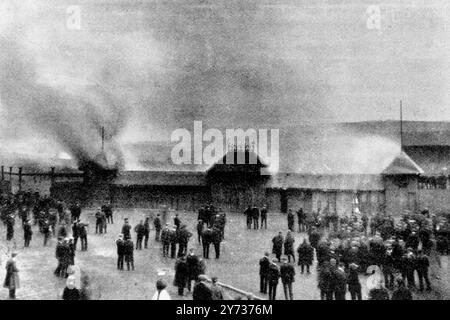 A replay of the game between the finalists in the competition for the Scottish Cup , the Celtic and the Rangers , both from Glasgow , took place on Saturday last . For the second time there was a draw . The crowd desired that there should be an extra half hour's play . Refused this wish they rioted and fired anything they could lay their hands on . Seen here , burning pay boxes at the ground of Queen's Park , at Hampden , Mount Florida , Glasgow , Scotland , after disappointed fans burnt everything in sight . 24 April 1909 Stock Photo