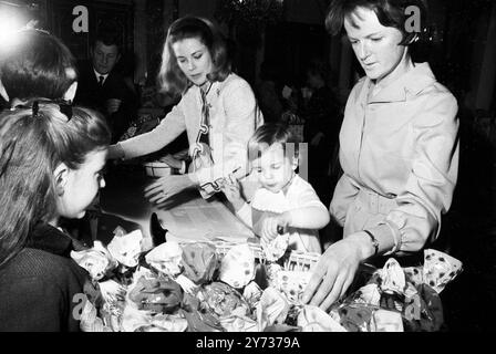 Princess Grace of Monaco , assisted by her young children , Princess Stephanie (pictured right) hands out Christmas gifts to children at a Christmas party in the Grimaldi Palace in Monaco on 21 December 1967 Stock Photo