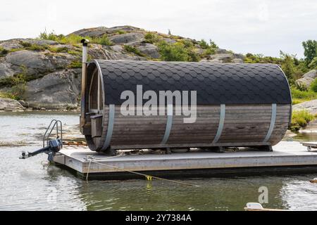 Gothenburg, Sweden - July 24 2022: Barrel shaped sauna on a raft. Stock Photo