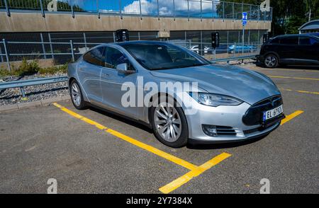 Ullared, Sweden - July 30 2022: Silver 2015 Tesla Model S electric car on a parking lot. Stock Photo