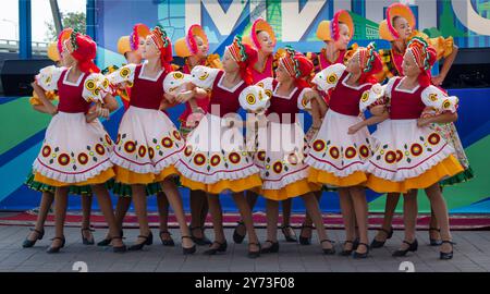 Minsk, Belarus - September 14, 2024: Girls participating in the folklore ensemble of national costumes perform in front of citizens and guests of the Stock Photo