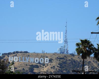 The Hollywood Sign, perched on the Hollywood Hills, symbolizes the global entertainment industry and the allure of Los Angeles' film and TV heritage. Stock Photo