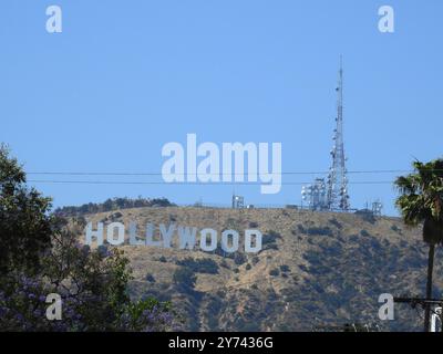 The Hollywood Sign, perched on the Hollywood Hills, symbolizes the global entertainment industry and the allure of Los Angeles' film and TV heritage. Stock Photo