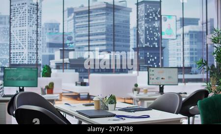 Empty well equipped business office with computers used in recruitment process, showcasing cv resumes and potential candidates. Human resources department deals with job interviews. Stock Photo
