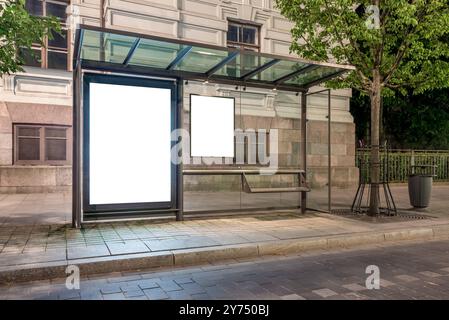 Mockup Of Bus Stop Blank Billboard For Branding Banner Or Poster. Two Empty Advertising Light Boxes At Night Stock Photo