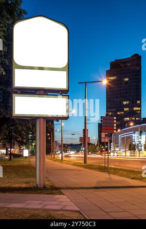 Three blank street billboard poster stands mock up in city downtown ...