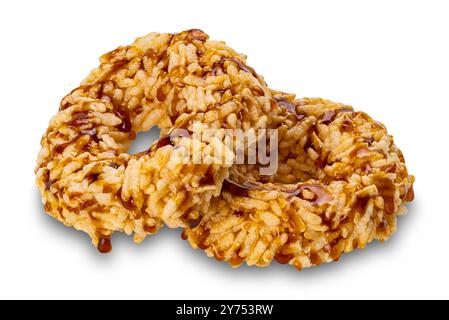 Closeup view of crispy homemade sweet rice crackers with cane sugar syrup isolated on white background with clipping path. Stock Photo