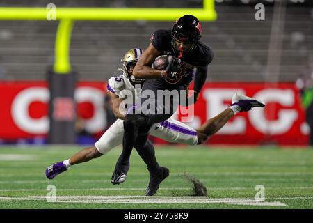 Piscataway, New Jersey, USA. 27th Sep, 2024. Wide receiver KJ DUFF (8) of the Rutgers Scarlet Knights runs with the ball after a catch while Washington Huskies cornerback ELIJAH JACKSON (25) tries to tackle him during the game between Rutgers University and Washington Huskies at SHI Stadium. (Credit Image: © Scott Rausenberger/ZUMA Press Wire) EDITORIAL USAGE ONLY! Not for Commercial USAGE! Stock Photo