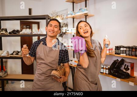 happy asian staff standing with holding tools Stock Photo