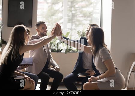 Happy excited united business team celebrating success Stock Photo