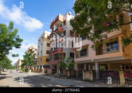 Residential multistory apartment buildings with city road at Rajarhat area of Kolkata, India. Stock Photo