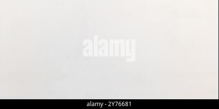 Simple bright white wide clean painted soft concrete wall background texture, minimal full frame wallpaper web banner, nobody, front view, well lit br Stock Photo