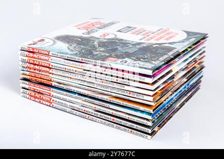 CD-Action PC games on CD discs added to a paper magazine, set, group of objects closeup, nobody. Lots of video games on CDs demos simple abstract conc Stock Photo