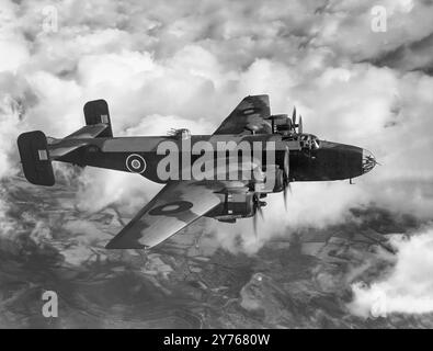 The Handley Page Halifax, a British Royal Air Force (RAF) four-engined heavy bomber of the Second World War. It performed its first flight in October 1939, and entered service with the RAF in November 1940 with production continuing until April 1945. It quickly became a major component of Bomber Command, performing strategic bombing missions against the Axis Powers, primarily at night. Stock Photo