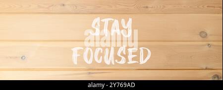 Stay focused symbol. Concept words Stay focused on beautiful wooden wall. Beautiful wooden wall background. Business, support, motivation, psychologic Stock Photo