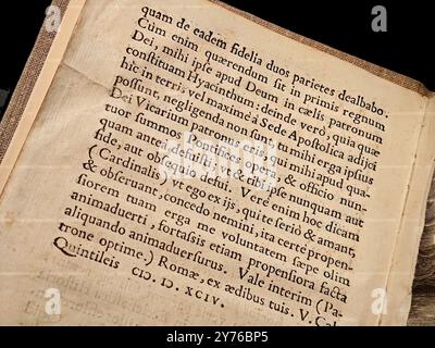 Simple old antique generic medieval book written in Latin gothic font, black ink letters object closeup detail, nobody, middle ages religious books an Stock Photo