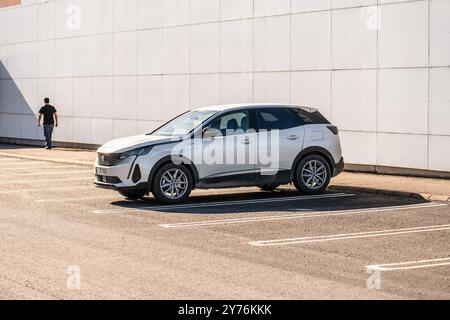 Gothenburg, Sweden - March 02 2023: White 2022 Peugeot 3008 hybrid SUV in a parking lot Stock Photo