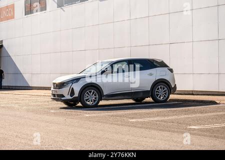 Gothenburg, Sweden - March 02 2023: White 2022 Peugeot 3008 hybrid SUV in a parking lot Stock Photo