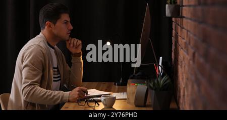 Programmer working with modern computer in office. Banner design Stock Photo