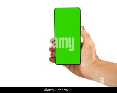 Hand holding smartphone with green screen Stock Photo