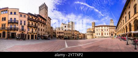 Italy travel and landmarks. Arezzo - beautiful medieval town in Tuscany . Panoramic view of main city scquare - Piazza grande Stock Photo