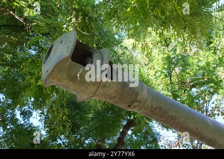 The iron gun of a World War II American armoured Sherman tank exhibited in a park in the French town of Colmar. Stock Photo