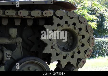 Main drive sprocket, iron caterpillar and other wheels of a World War II American armoured Sherman tank exhibited in a park in the French. Stock Photo