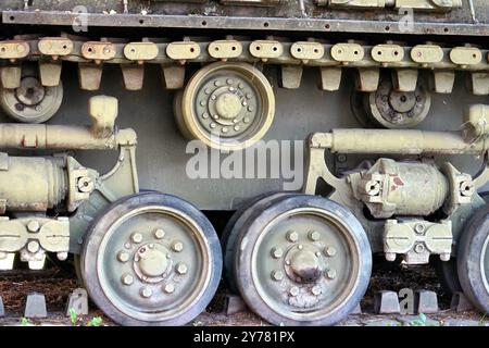 The iron caterpillar and wheels of a World War II American armoured sherman tank exhibited in a park in the French town of Colmar. Stock Photo