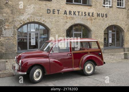 Vintage car parked in front of the cultural centre The Arctic House or Det Arktische Hus, Christianshavn district, Copenhagen, Denmark, Europe Stock Photo