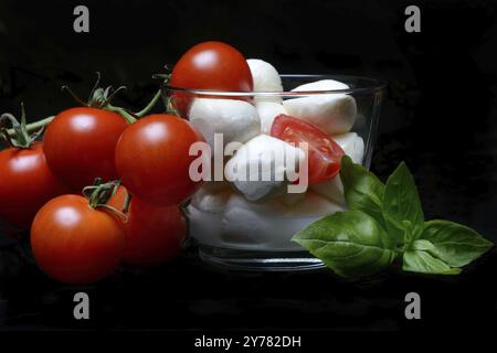 Cherry tomatoes and mozzarella cream cheese in a jar, cherry tomato Stock Photo