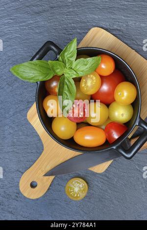Various cherry tomatoes in pots, cherry tomato Stock Photo