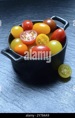 Various cherry tomatoes in pots, cherry tomato Stock Photo