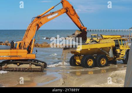 Construction of breakwaters, construction equipment on the sea coast, Baltic sea, Kaliningrad region, Russia, July 15, 2018, Europe Stock Photo