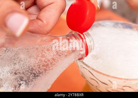 new plastic bottle cap attached to the neck of the container to facilitate recycling Stock Photo