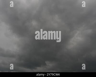 Cumulonimbus cloud formations on tropical sky , Nimbus moving , Abstract background from natural phenomenon and gray clouds hunk , Thailand Stock Photo