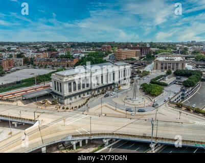 Aerial view of Penn Station Baltimore, classic East Coast rail station for commuter and passenger trains with cloudy sky background Stock Photo