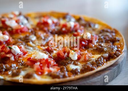 Nacho with minced meat and tomato salsa sauce Stock Photo