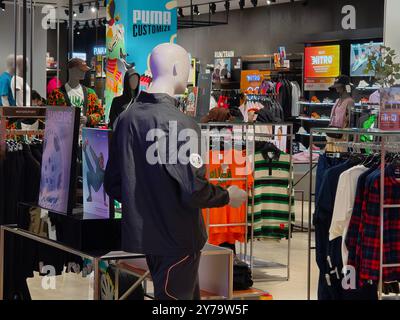 KUALA LUMPUR, MALAYSIA - AUGUST 28, 2024: Puma brand retail shop in the large shopping mall Stock Photo