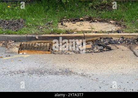 Pot hole caused by blocked drain, Church Lane, Cherry Willingham, Lincoln, Lincolnshire, England, UK Stock Photo