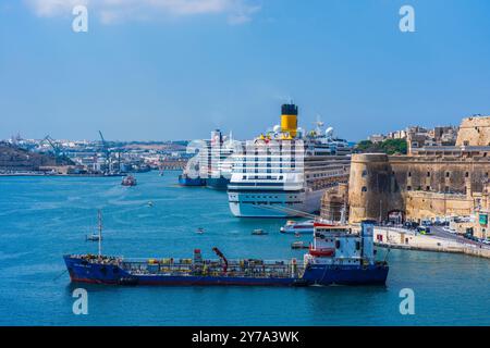 VALLETTA, MALTA - AUGUST 30 2024: View of Grand harbour with cruise ships and boats in Valletta - the capital city of the Mediterranean island nation Stock Photo