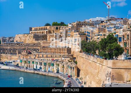 VALLETTA, MALTA - AUGUST 30 2024: View of Grand harbour waterfront of Valletta - the capital city of the Mediterranean island nation of Malta Stock Photo