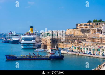 VALLETTA, MALTA - AUGUST 30 2024: View of Grand harbour with cruise ships and boats in Valletta - the capital city of the Mediterranean island nation Stock Photo