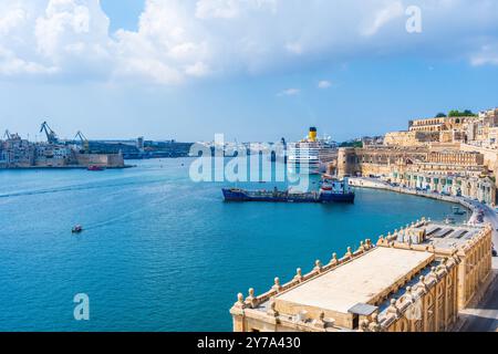 VALLETTA, MALTA - AUGUST 30 2024: View of Grand harbour with cruise ships and boats in Valletta - the capital city of the Mediterranean island nation Stock Photo