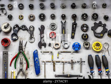 Mechanic tools hanging on a wall Stock Photo