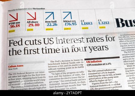 'Fed cuts US interest rates for the first time in four years' Guardian newspaper headline 19 September 2024 London UK Stock Photo