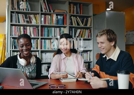 Students Having Online Conference In The Library Stock Photo