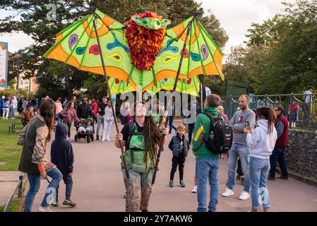 Bournemouth, Dorset, England, UK, 28th September 2024. Arts by The Sea festival. Bat puppeteer Echo by Hannah Greenspace walk through Lower Gardens. Credit: Paul Biggins/Alamy Live News Stock Photo