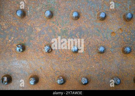 Riveted rusty steel rail bridge close up for textures and patterns Stock Photo